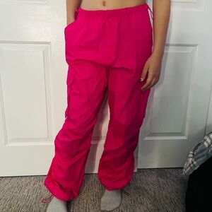 Bright pink neon parachute pants